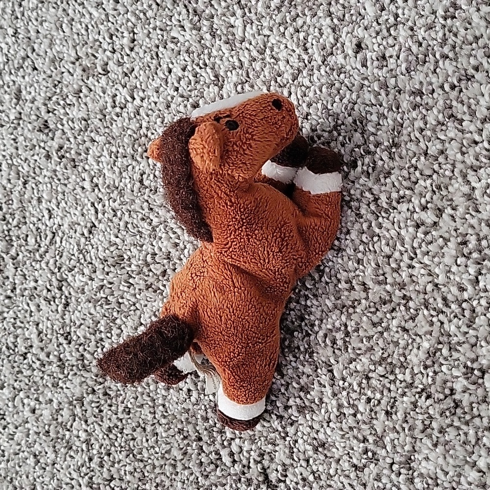 Tiny horse stuffed animal.
